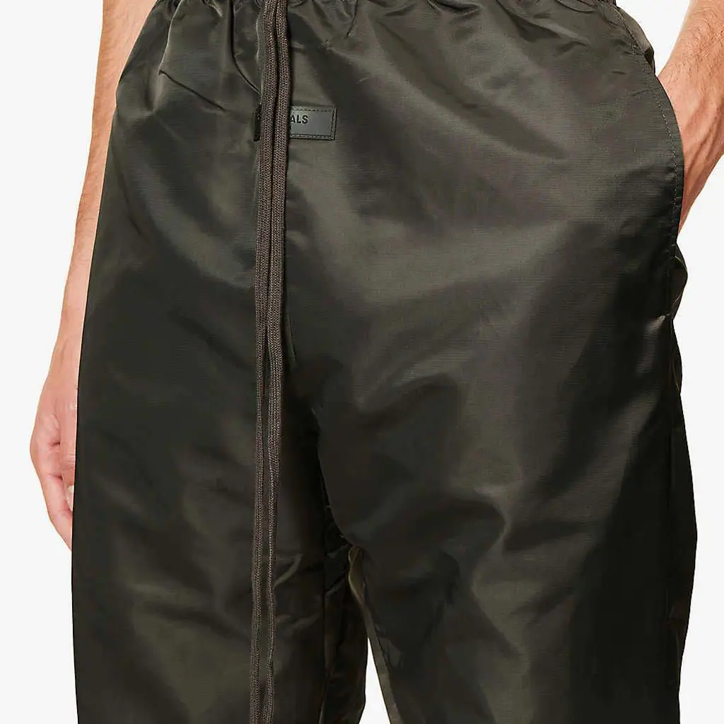 Fear Of God ESSENTIALS Tapered Shell Jogging Bottoms - Off Black - Image 4